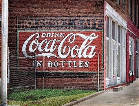 Local building with Coca-Cola Logo painted on side